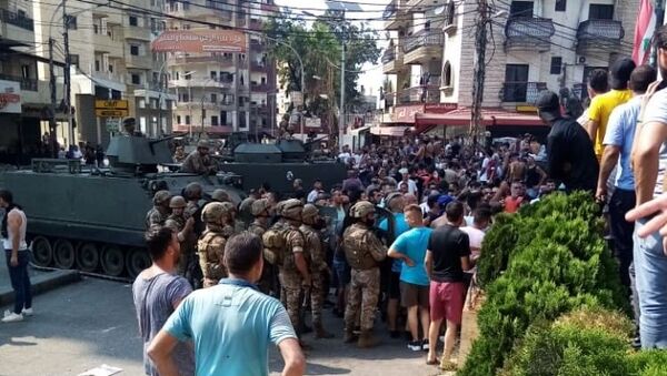 Lübnan’da Saad Hariri’nin hükümeti kurmayacağını açıklamasının ardından başlayan gösteriler devam ederken, Trablusşam kentinde çıkan çatışmada 25 kişi yaralandı. - Sputnik Türkiye
