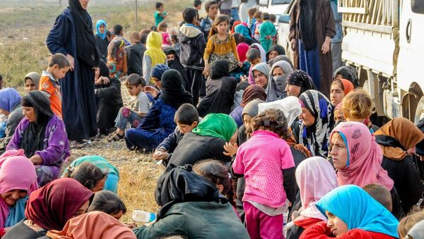 Musul'da IŞİD zulmünden kaçanlar - Sputnik Türkiye