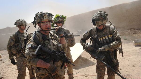 In this photo taken on August 5, 2011, US troops from the Charlie Company, 2-87 Infantry, 3d Brigade Combat Team under Afghanistan's International Security Assistance Force patrols Kandalay village following Taliban attacks on a joint US and Afghan National Army checkpoint protecting the western area of Kandalay village. - Sputnik Türkiye