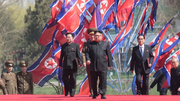 DPRK leader Kim Jong-il, center, at a ceremony to open a new residential area on Ryomyong Street in Pyongyang. - Sputnik Türkiye