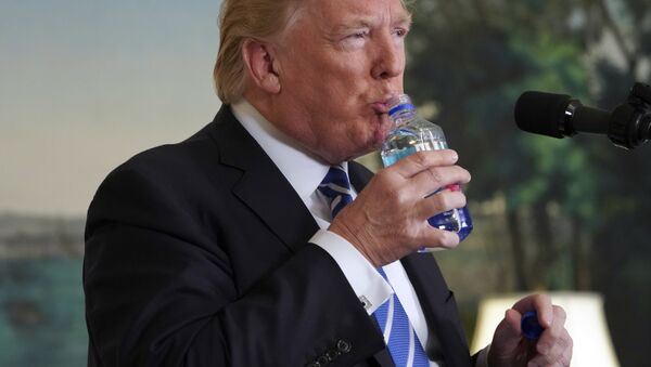 President Donald Trump pauses to drink water as he speaks in the Diplomatic Reception Room of the White House, Wednesday, Nov. 15, 2017 in Washington - Sputnik Türkiye