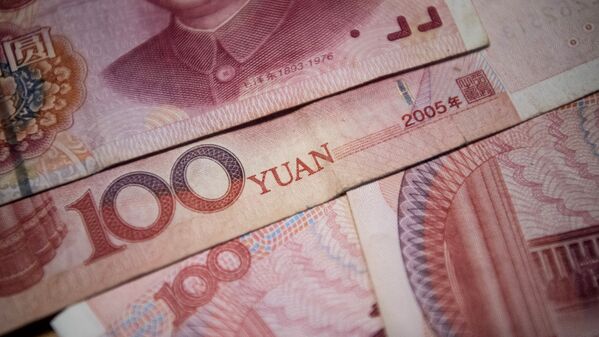 This photo illustration taken on September 29, 2016 shows Chinese 100 yuan notes in Beijing. - Sputnik Türkiye