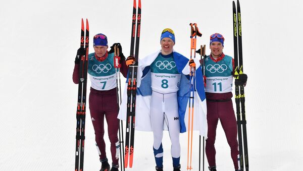 Medalists in the 50-km mass start race in men’s cross-country skiing at the XXIII Olympic Winter Games in Pyeongchang, from left: Alexander Bolshunov (Russia) - silver medal; Iivo Niskanen (Finland) - gold medal; and Andrei Larkov (Russia) - bronze medal - Sputnik Türkiye
