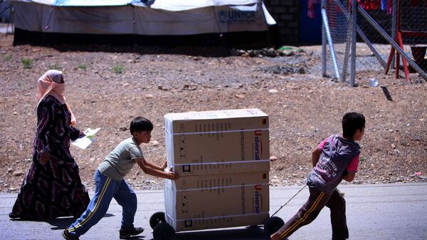 Erbil Daraşakran sığınmacı kampı Suriyeli sığınmacılar yardım dağıtımı  - Sputnik Türkiye
