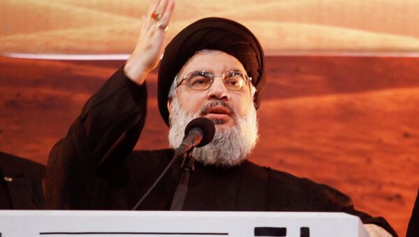 Lebanon's Hezbollah leader Sayyed Hassan Nasrallah addresses his supporters during a rare public appearance at an Ashoura ceremony in Beirut's southern suburbs November 3, 2014 - Sputnik Türkiye