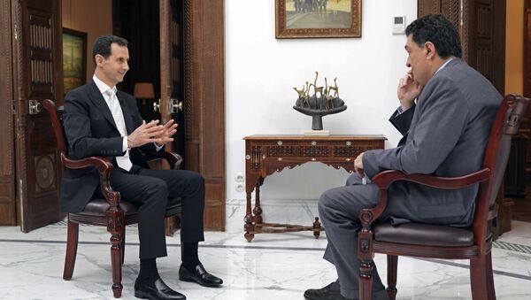 Suriye Devlet Başkanı Beşar Esad, Yunanistan'ın Katimerini gazetesinden Aleksis Papaçelas'ın sorularını yanıtladı. - Sputnik Türkiye