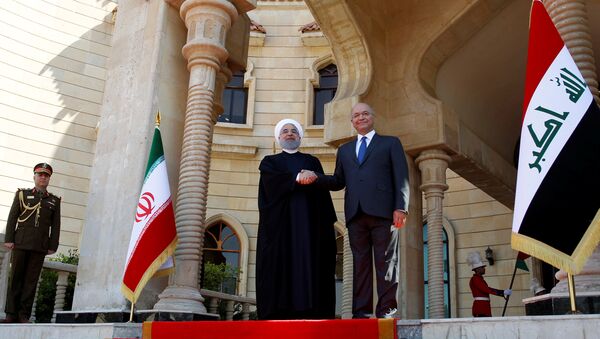 İran Cumhurbaşkanı Hasan Ruhani, resmi ziyaret kapsamında ilk kez gittiği Irak'ın başkenti Bağdat'ta Cumhurbaşkanı Berhem Salih tarafından karşılandı. - Sputnik Türkiye